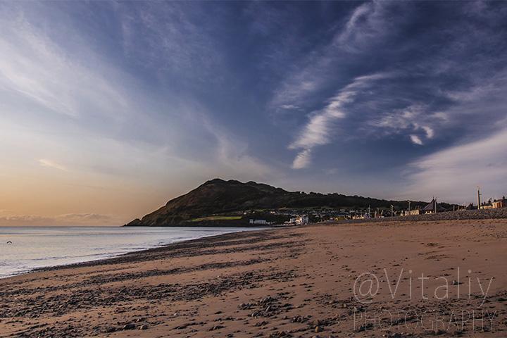 Irish landscape. Sandy beach at Bray town with Bray Head on background.